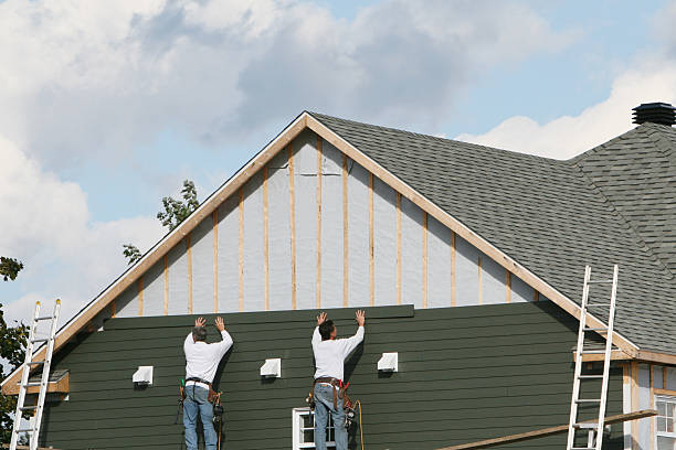 Professional Emergency Siding Repair technician working in Newton Center, MA